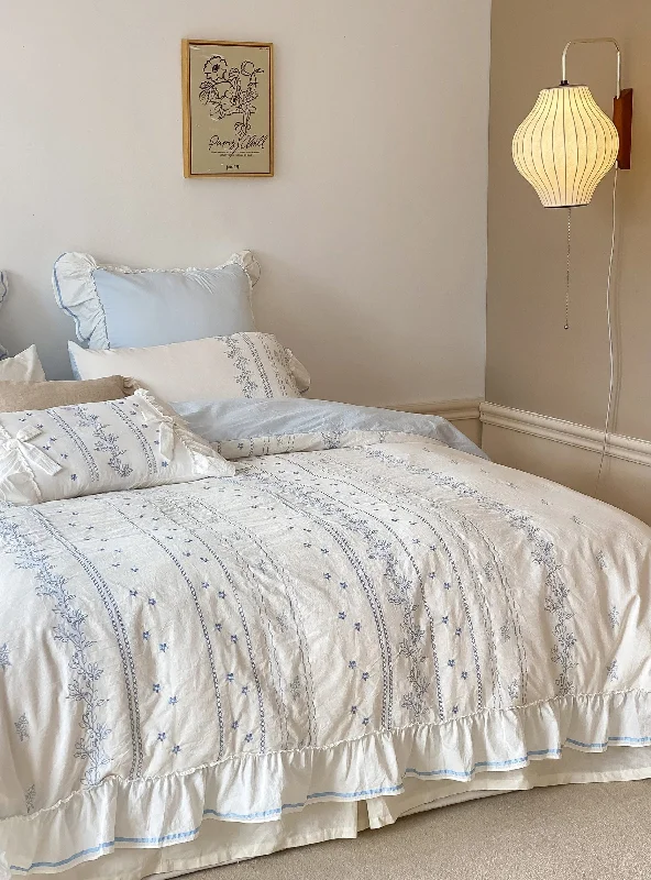 Solid - colored duvet covers in classic colors like white, black, and navy for a timeless lookEmbroidered French Lace Ruffle Duvet Cover / Blue