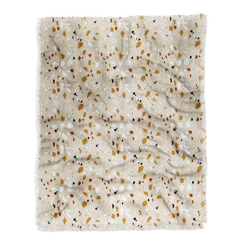 Cotton blankets for breathability and a lightweight feelIveta Abolina Terrazzo Tan Throw Blanket