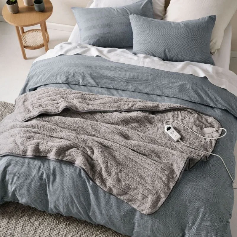 Bamboo fiber blankets with natural antibacterial propertiesSherpa Heated Plush Throw Light Grey by Linen House